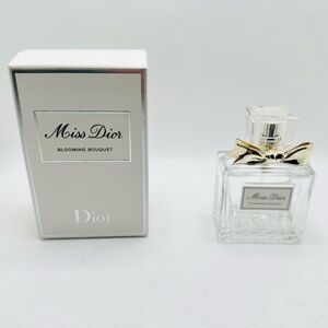 Dior Miss Dior Blooming Bouquet 3.4 FL OZ bottle with silver bow and box, empty